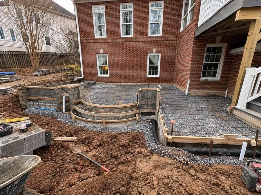 Reinforced base and drainage before stone