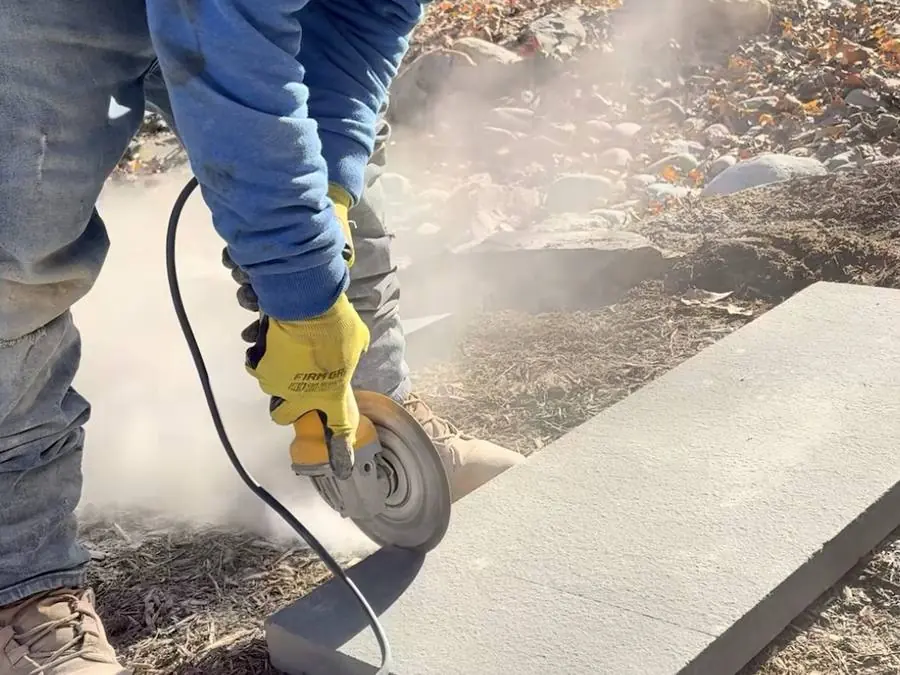 Mason cutting bluestone